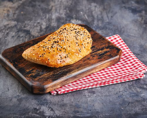 Samosa, samsa meat stuffed pies. Uzbek national dish samosa. Concept of Central Asian, South and East Asian cuisine.