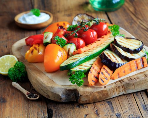 Grilled vegetables on a wooden board